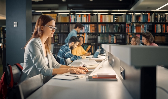 Female college student at the library.