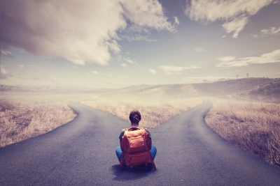 Female student in front of two paths