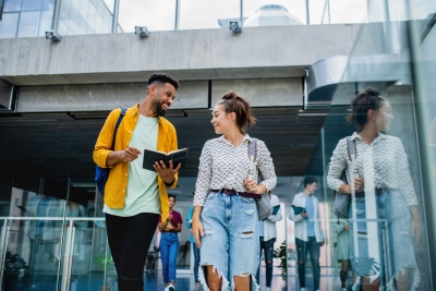 College students smiling outside campus