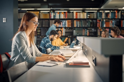 Female college student at the library.